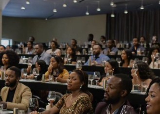 A full room of guests tasting wine together during a guided seminar